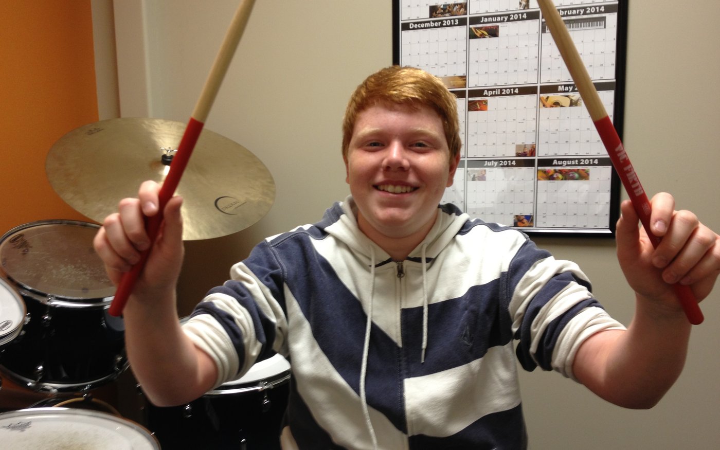 A drum student mid-lesson